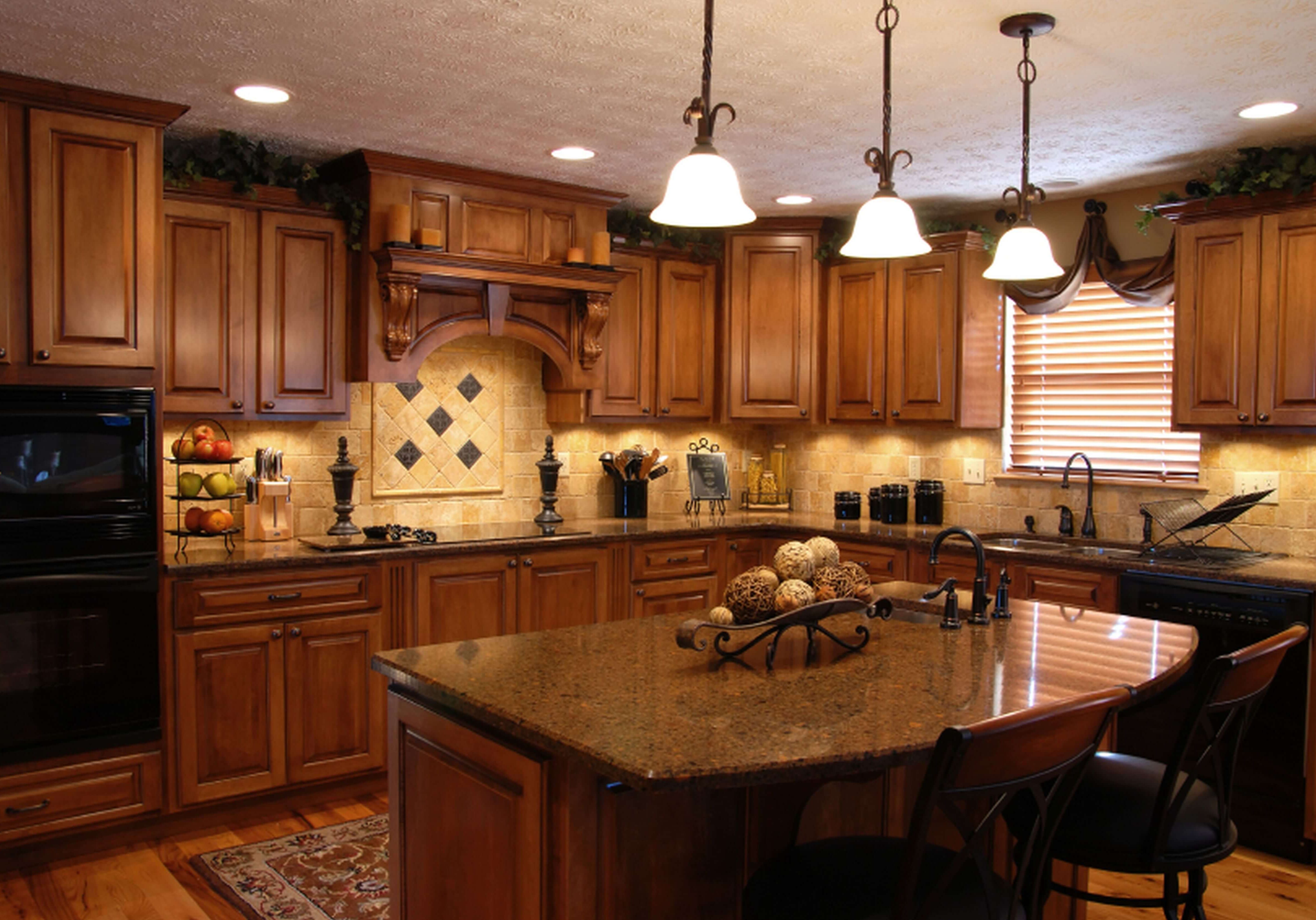 Luxury kitchen remodel with warm wood cabinetry and granite island
